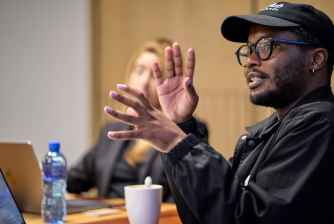Creator presenting ideas in a team meeting